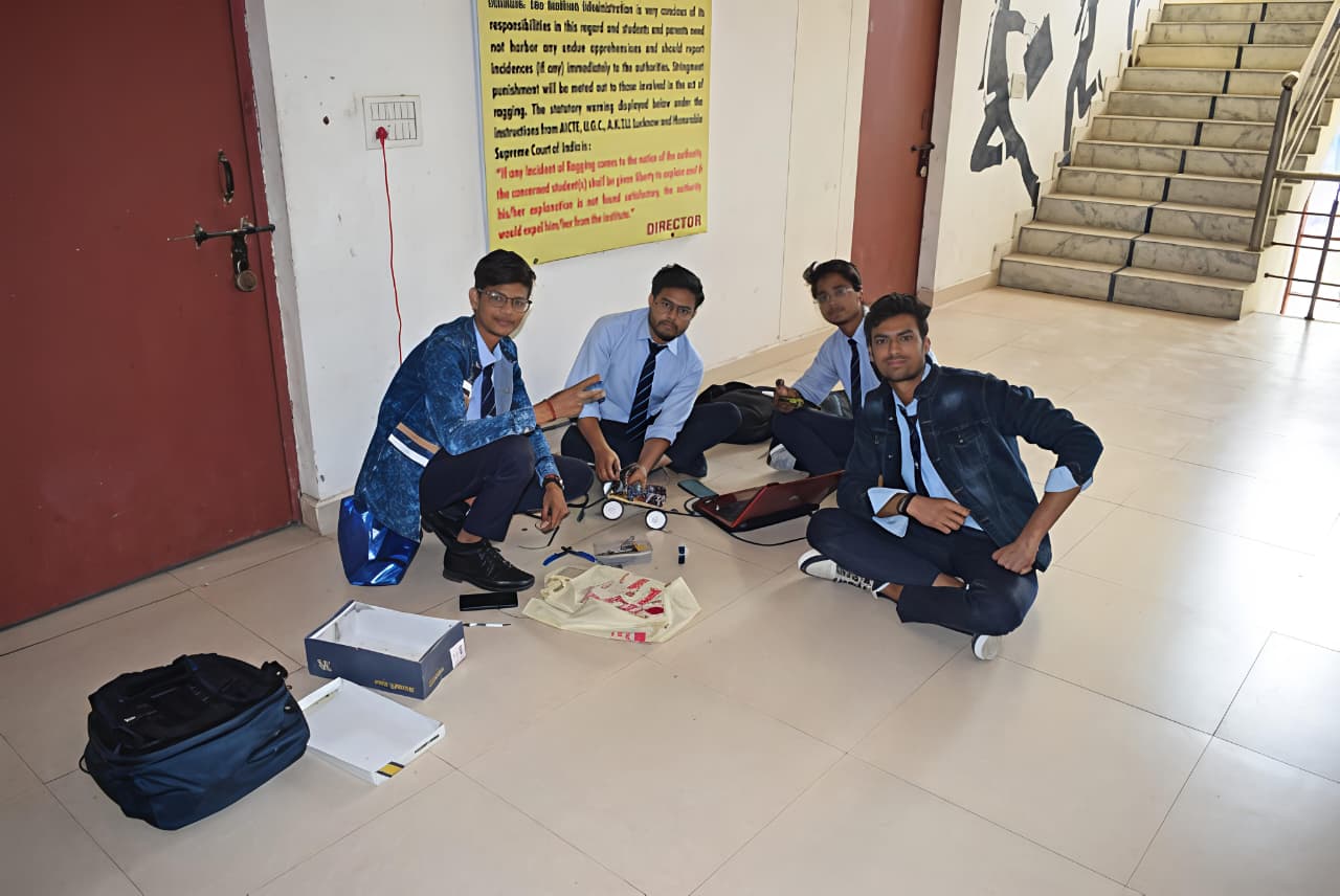 Team building robotic car with electronics and sensors